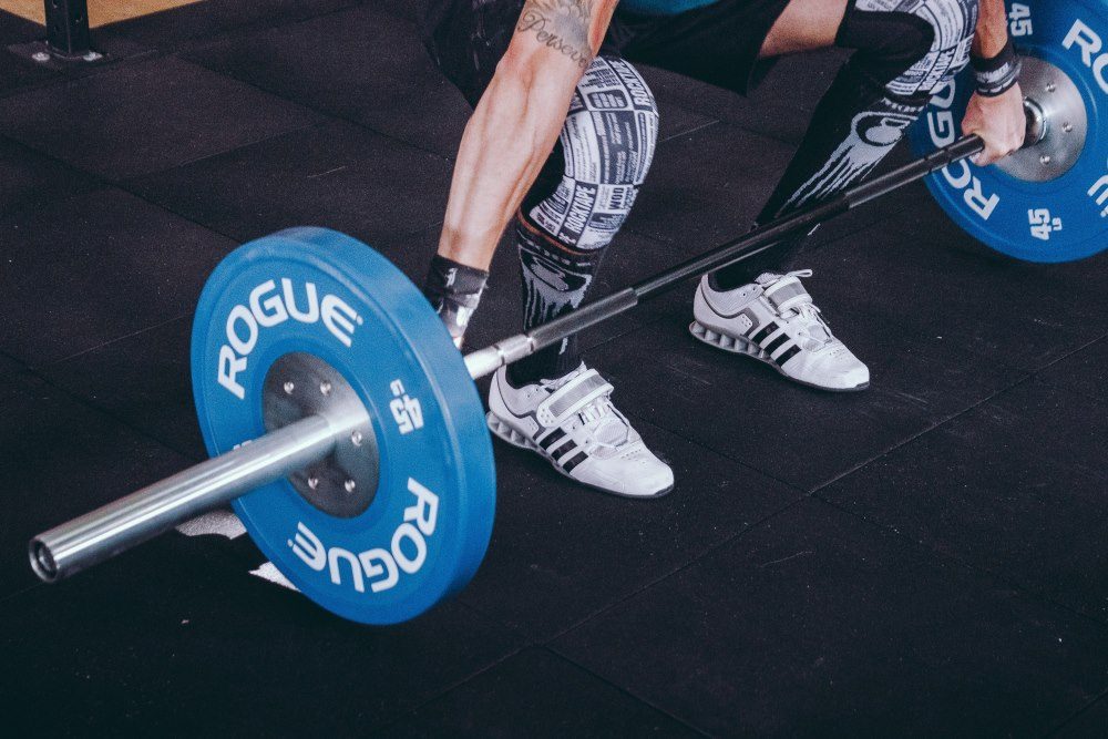 Weightlifting the barbell at the Olympics.