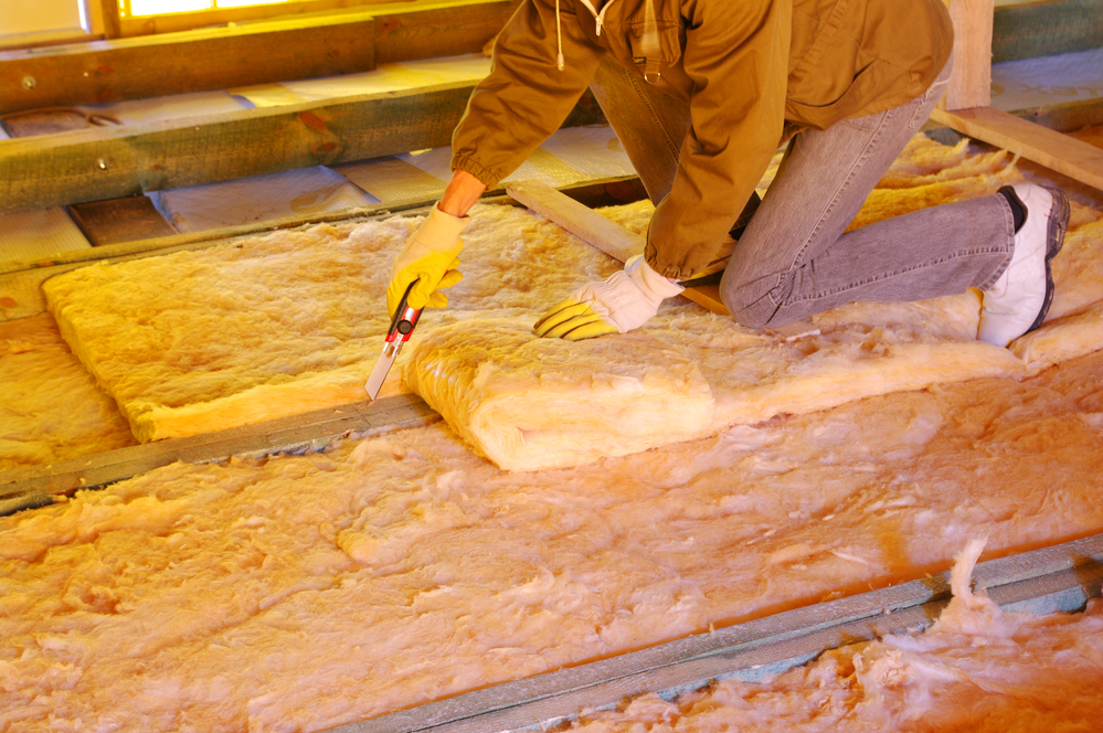 Insulation material being installed in an attic