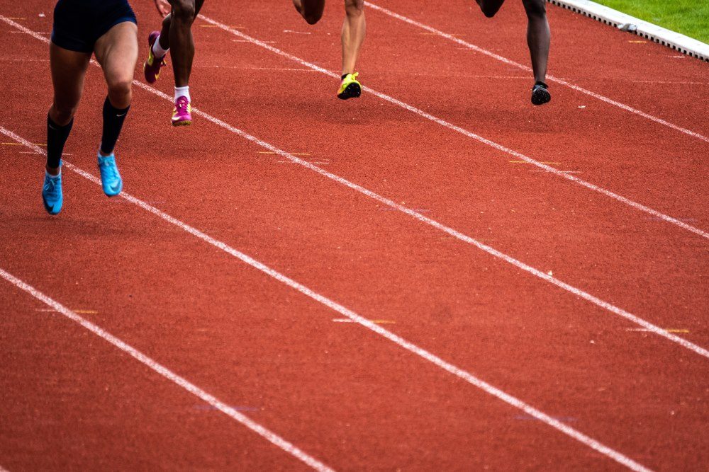 Four runners in a running race